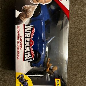 Wwe The rock and breakable car brand new